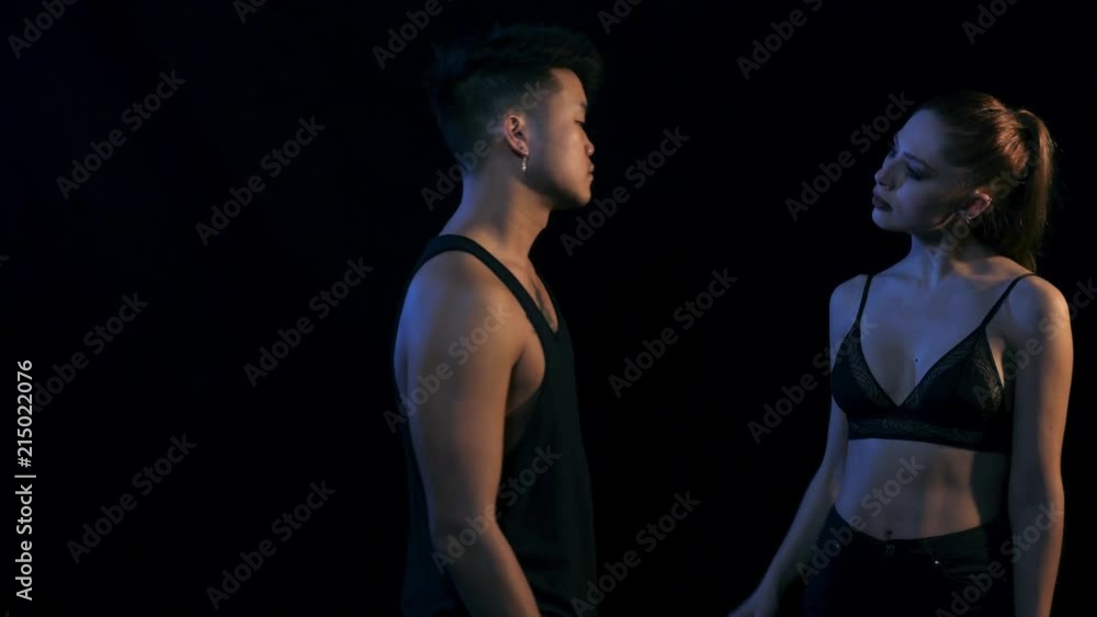 Young Woman and Man Gently Touching Each Other Young Woman and Man Gently Touching Each Other