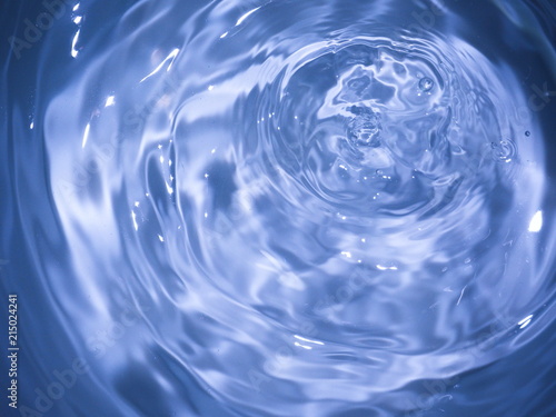Top view Closeup blue water rings, clear water, Close-up water droplets affect the surface, forming rings on the surface. reflections in blue water.