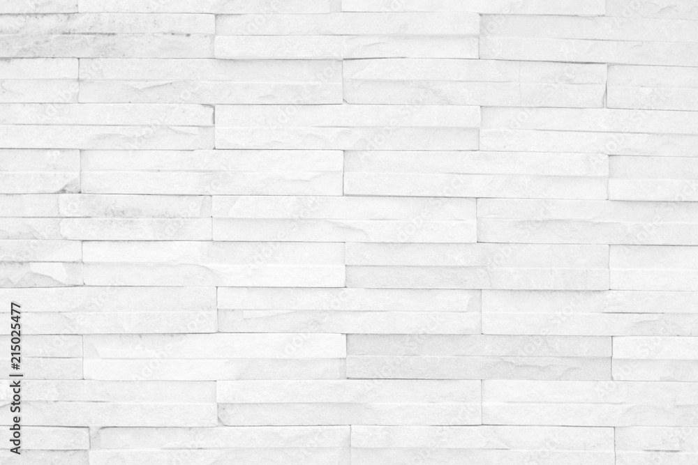 Grey and white brick wall texture background. Brickwork or stonework flooring interior rock old pattern clean concrete grid uneven bricks design stack. Grey and white brick wall texture background. Brickwork or stonework flooring interior rock old pattern clean concrete grid uneven bricks design stack.