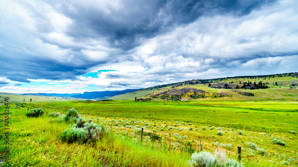 Dark Clouds hanging over the fertile farmland and rolling hills along Highway 5A near Nicola Lake, between Kamloops and Merritt in the Okanagen region of British Columbia, Canada