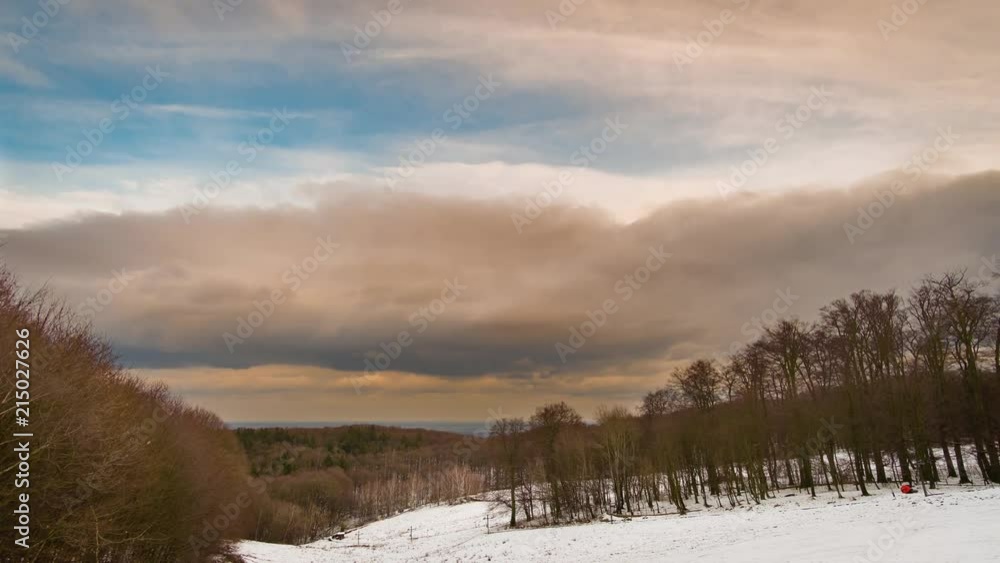 Moving clouds above snowy winer forest timelapse Moving clouds above snowy winer forest timelapse
