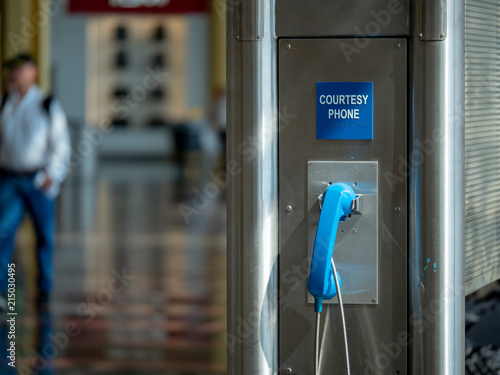 Photography Blue public use courtesy phone located at an airport