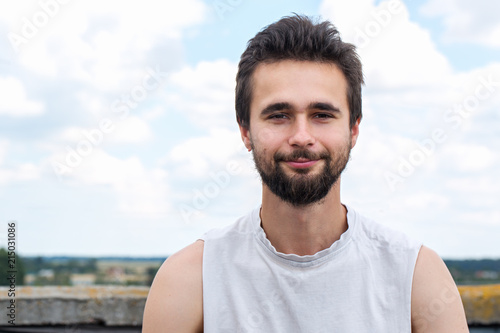 Portrait of a young man with a beard close-up