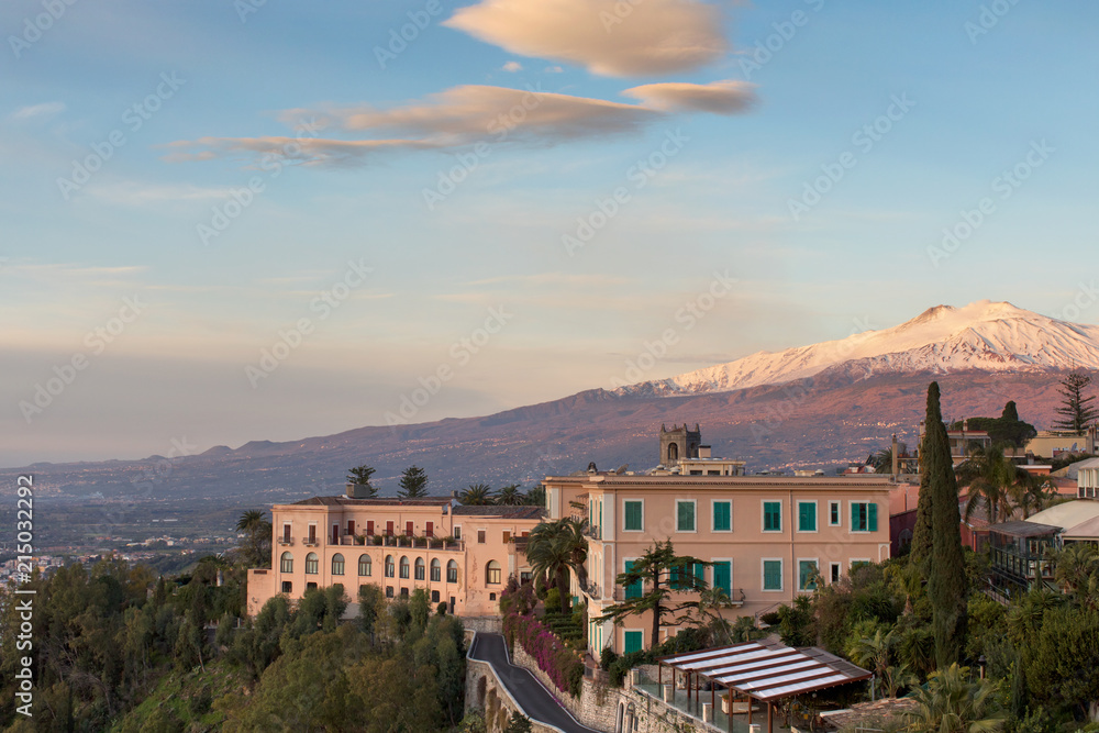 Mount Etna covered in snow seen from Taormina, Sicily, Italy
