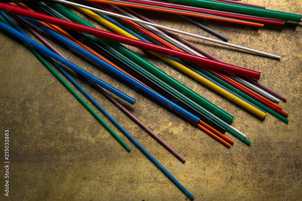 colored plastic chopsticks in an abstract composition