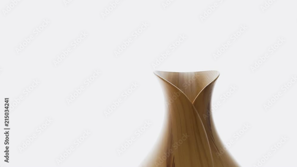 Wooden bamboo essential oil diffuser macro closeup, with steam modern minimalistic minimal health vapor by window