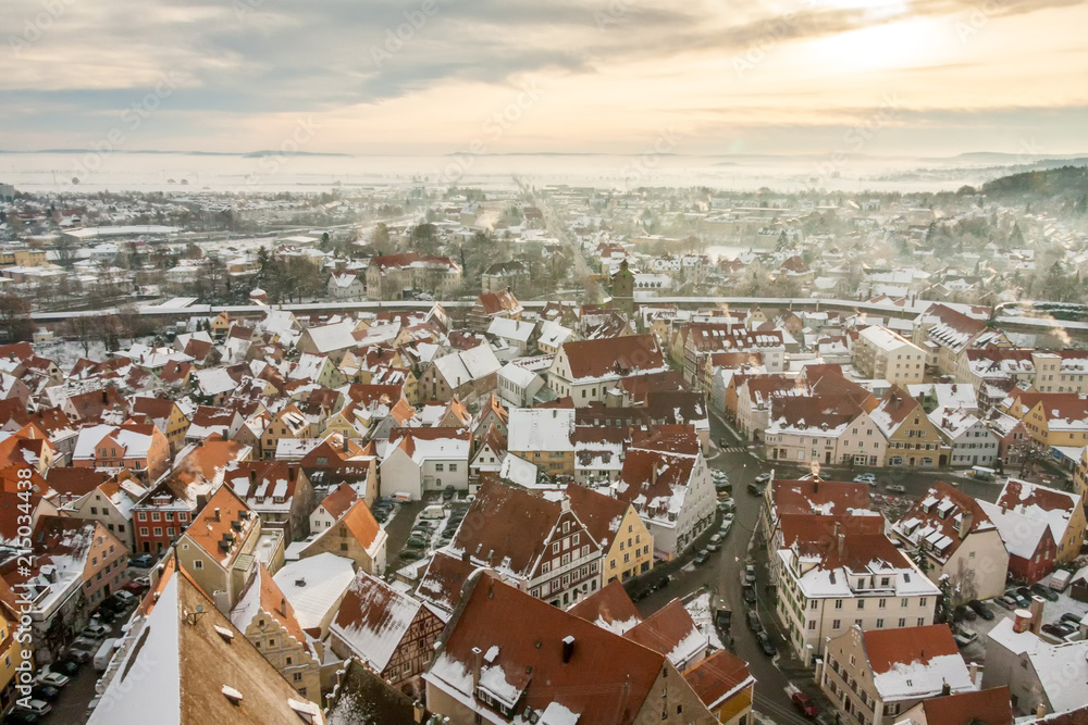 Top view on winter panorama of medieval town within fortified wall. Romantic Road route, Nordlingen, Bavaria, Germany.