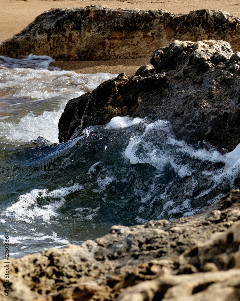 Fototapeta premium Powerful Waves on a rocky beach. Splits waves against rocks in the sea