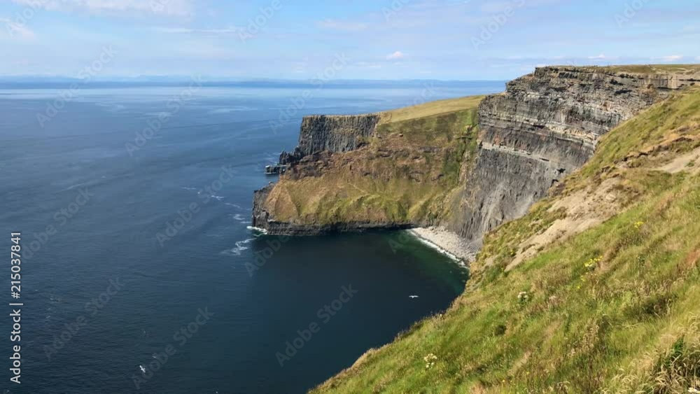 The famous Cliffs of Moher are sea cliffs located at the southwestern edge of the Burren region in County Clare, Ireland. They run for about 14 kilometres. The famous Cliffs of Moher are sea cliffs located at the southwestern edge of the Burren region in County Clare, Ireland. They run for about 14 kilometres.