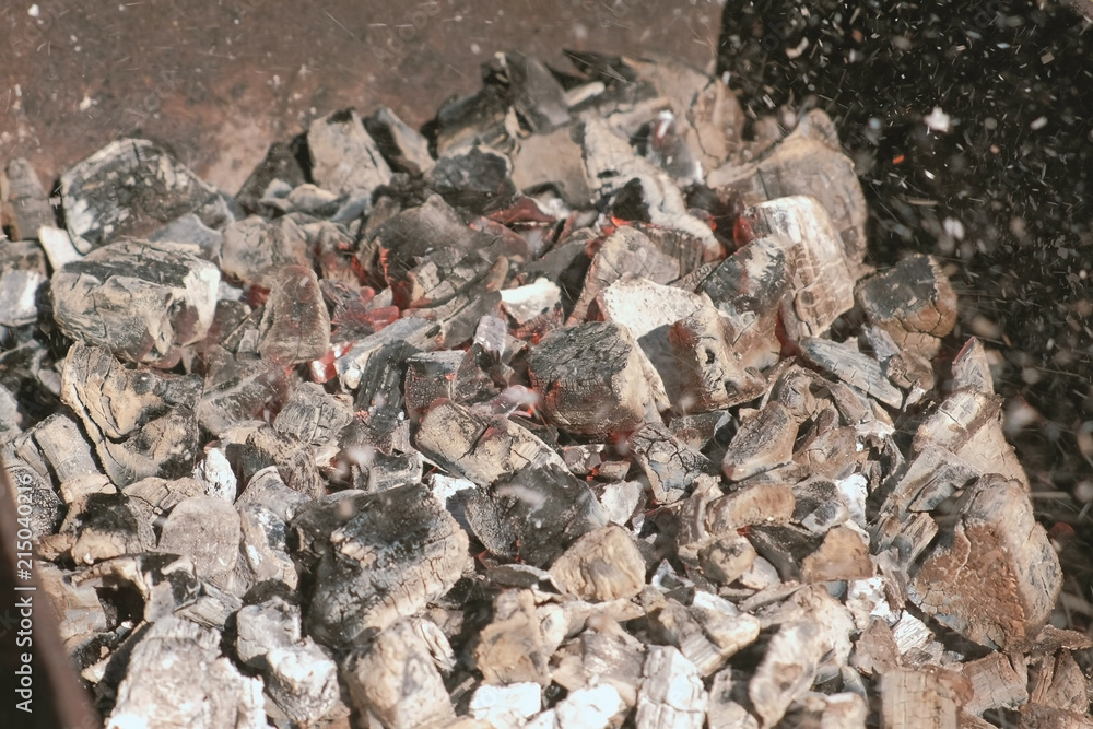 Hot coals in the grill brazier close-up. Hot coals in the grill brazier close-up.