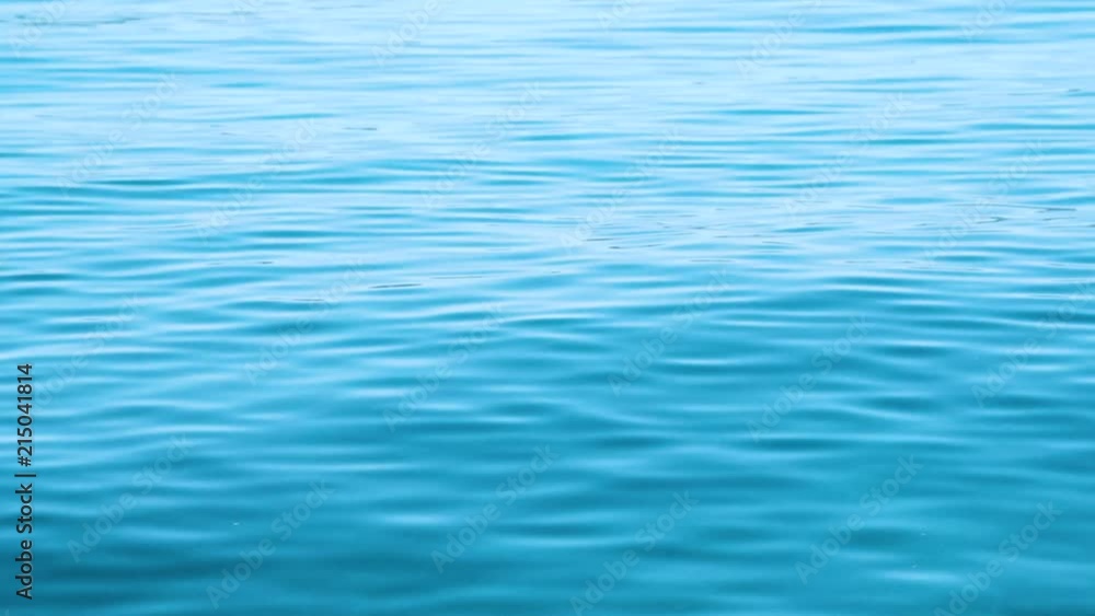 Calm blue water background Calm blue water background