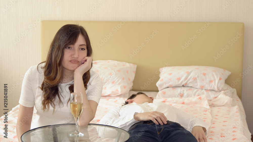 Young man fell asleep in the bedroom during a romantic evening