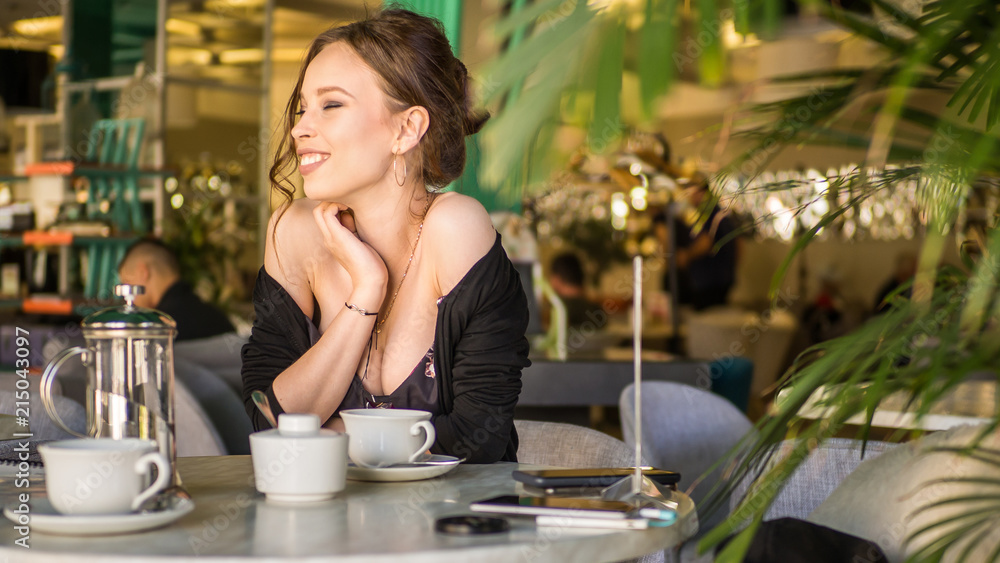 woman drinking coffee in the morning at restaurant, soft focus on the eyes woman drinking coffee in the morning at restaurant, soft focus on the eyes
