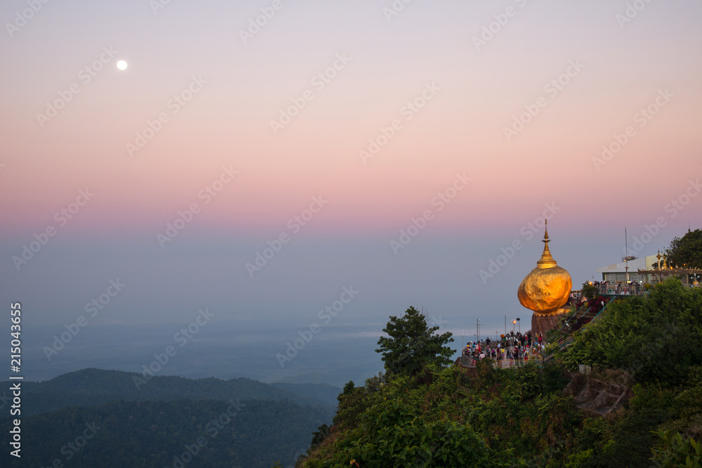 Fototapeta premium The scenery view of Kyaiktiyo pagoda or Golden rock pagoda under the moonlight before sunrise. 