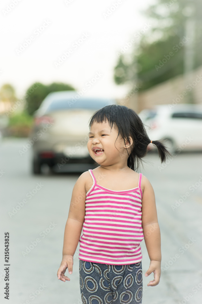 Portrait of asian happy laughing child girl