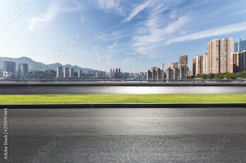 Panoramic skyline and modern business office buildings with empty road empty concrete square floor