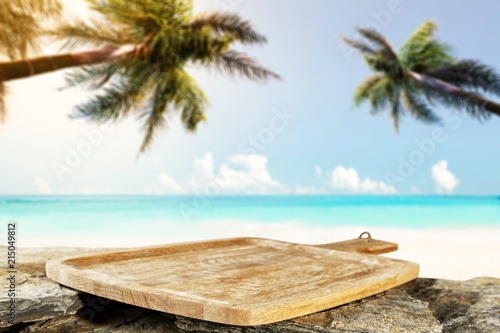 Fototapeta Naklejka Na Ścianę i Meble -  Table background and sea landscape with two palms 