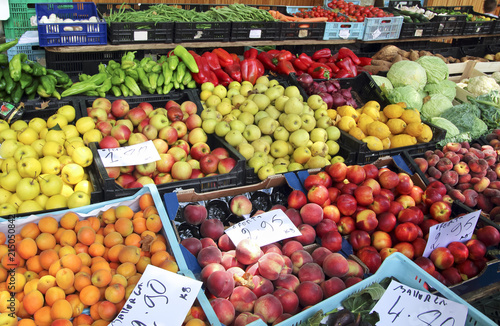 Fresh colorful fruits and vegetables on a market. Farmers street froit market with prices in euro in Spain. © alexialex