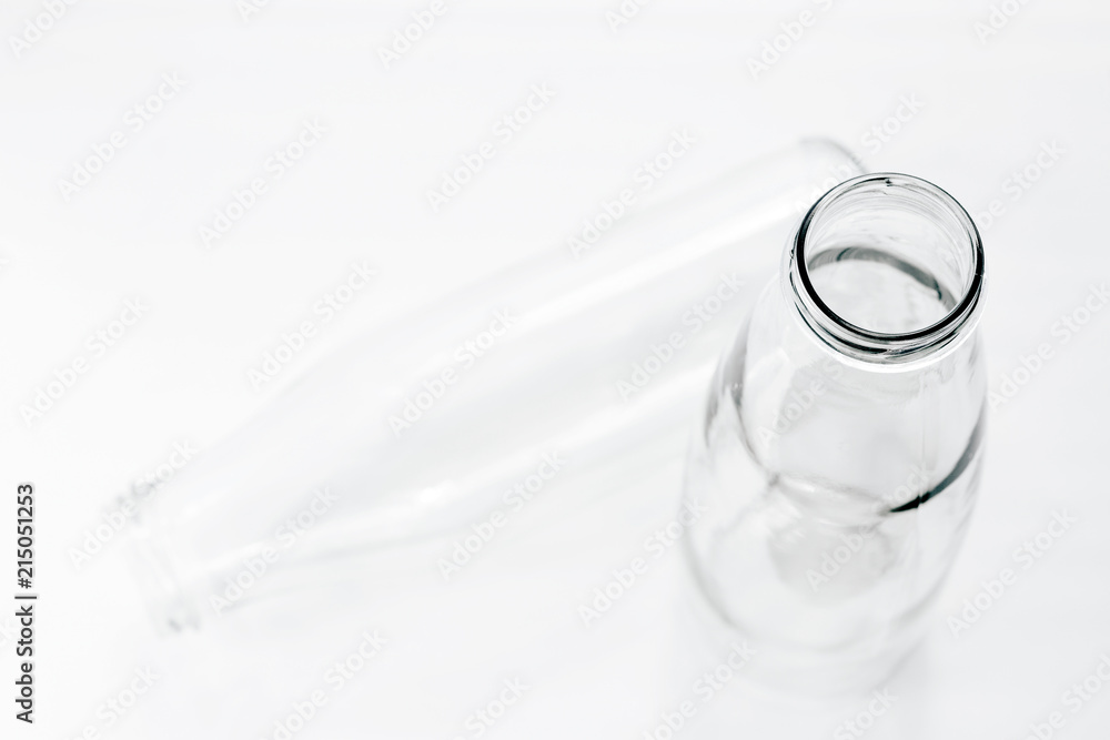 Two empty milk or kefir bottles of different shapes with copy space Two empty milk or kefir bottles of different shapes with copy space