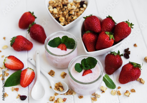 healthy breakfast, yogurt, fresh strawberries and granola