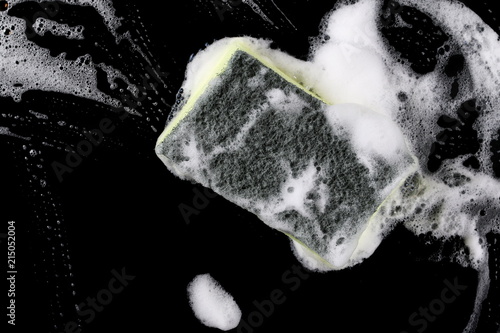 Foam with bubbles and sponge isolated on black background, with clipping path texture