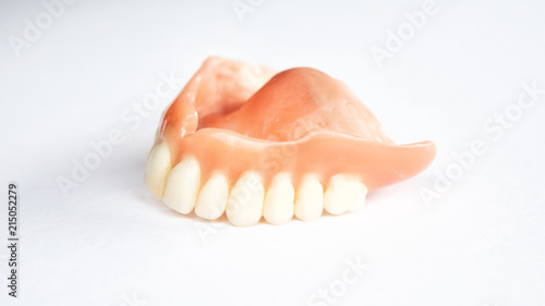 closeup of dental prosthesis on white background