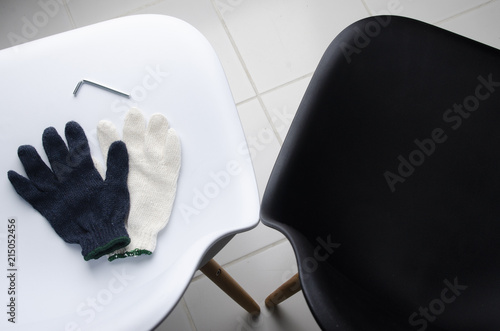 Glove on the wthie chair with ailen key. DIY Concept.