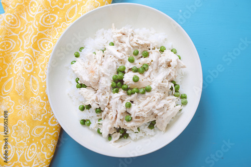 Tasty coconut chicken served on dish photo