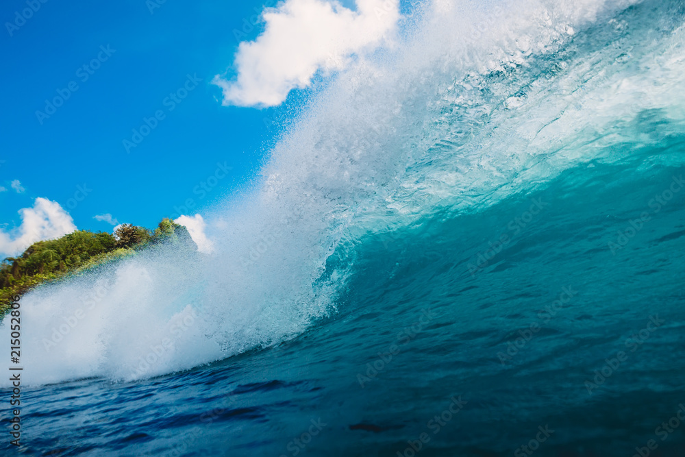 Blue wave in ocean. Breaking barrel wave in Bali