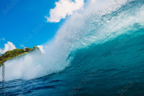 Blue wave in ocean. Breaking barrel wave in Bali
