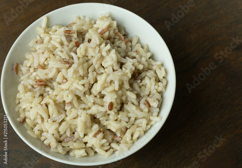A Cooked  Jasmine Rice , Brown Rice in bowl  on wood table.