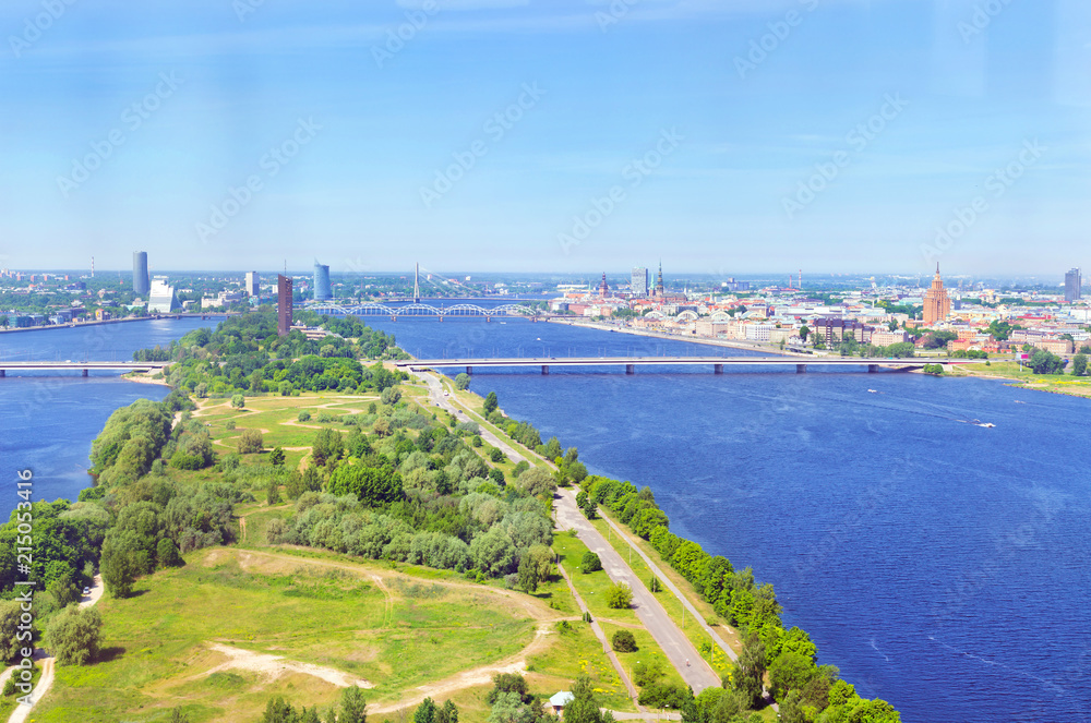 Summer aerial view of city Riga from the height of the TV tower. View of the old town, Zakusala island, bridges over the rivers Daugava and Western Dvina. Latvia, Baltic States, European Union
