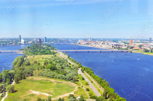 Summer aerial view of city Riga from the height of the TV tower. View of the old town, Zakusala island, bridges over the rivers Daugava and Western Dvina. Latvia, Baltic States, European Union photo