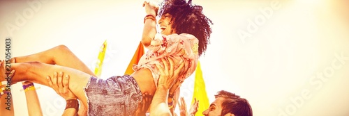 Happy hipster woman crowd surfing