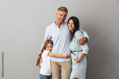 Portrait of a happy family father, mother, little daughter