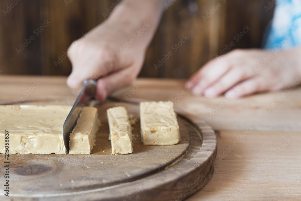 Spanish almond nougat on wooden table (sweet christmas) Spanish almond nougat on wooden table (sweet christmas)