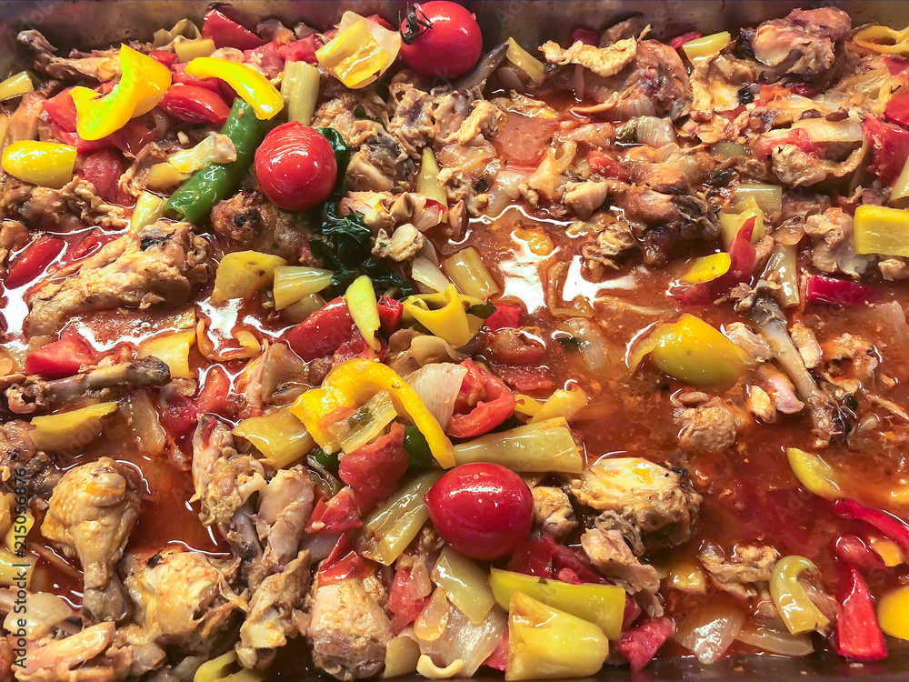 Stewed vegetables with slices of meat in tomato sauce Stewed vegetables with slices of meat in tomato sauce