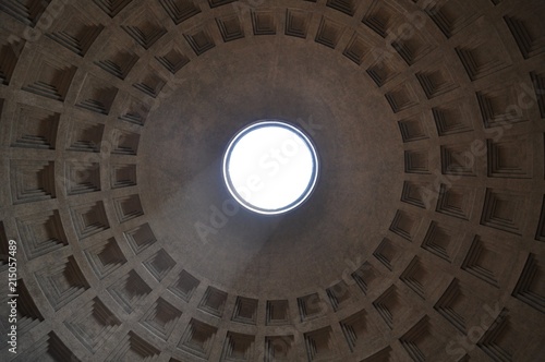 Light is coming in from a dome in an ancient Italian building