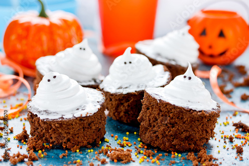 Halloween ghost brownies, chocolate cakes with white meringue ghosts for treat children to Halloween