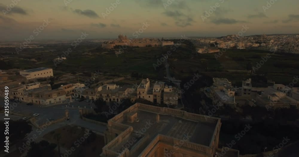 Aerial shot over a school in Rabat moving towards Mdina Aerial shot over a school in Rabat moving towards Mdina