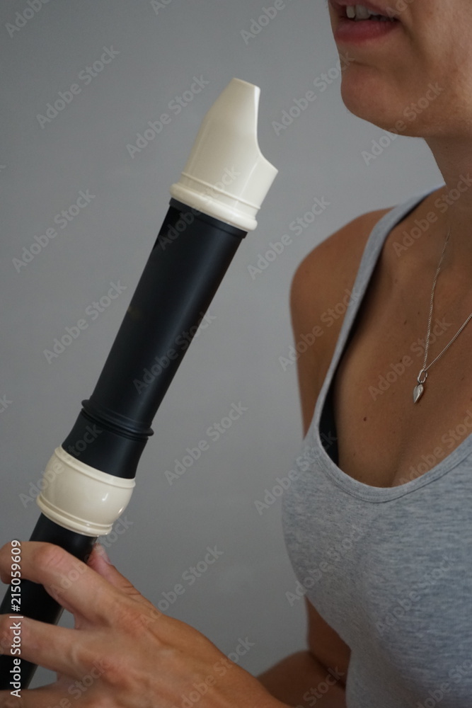 Fototapeta premium Woman playing tenor recorder