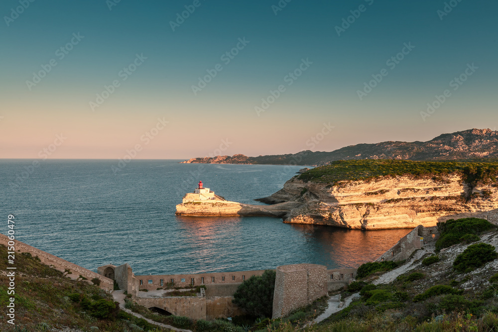 Sunlight on lighthouse at entrance to Bonifacio harbour in Corsica