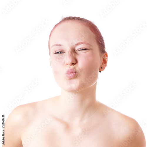 cute young woman with pursed lips and winking