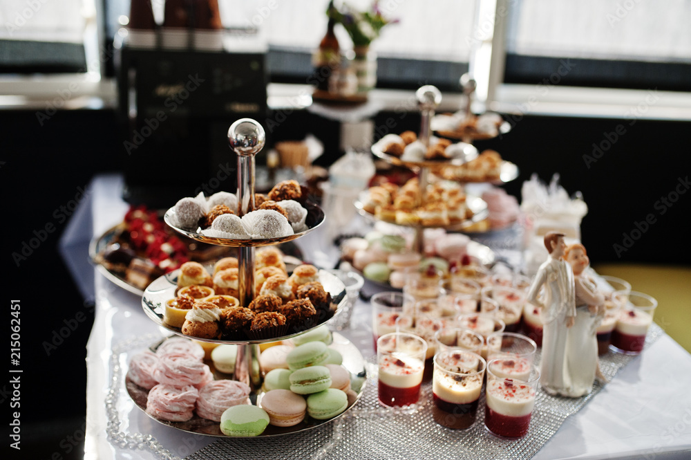 Close-up photo of delicious desserts on the wedding buffet.