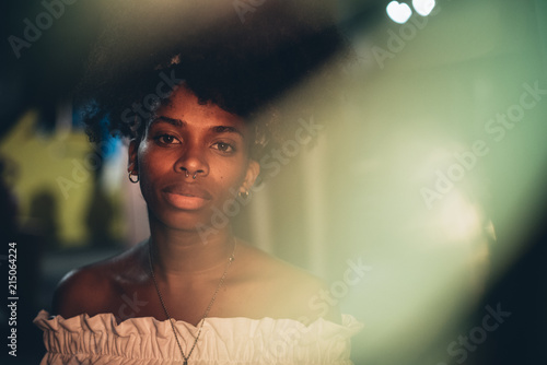 Young modern black woman in light flash photo