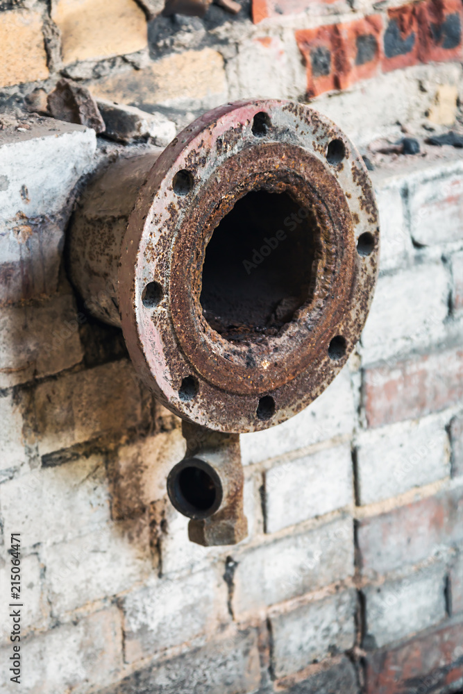 old rusty pipes in the destroyed boiler room