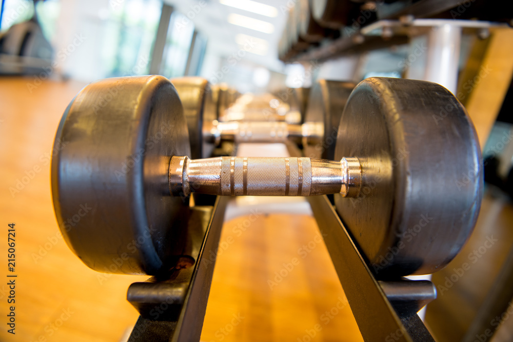 Row of dumbbells at gym