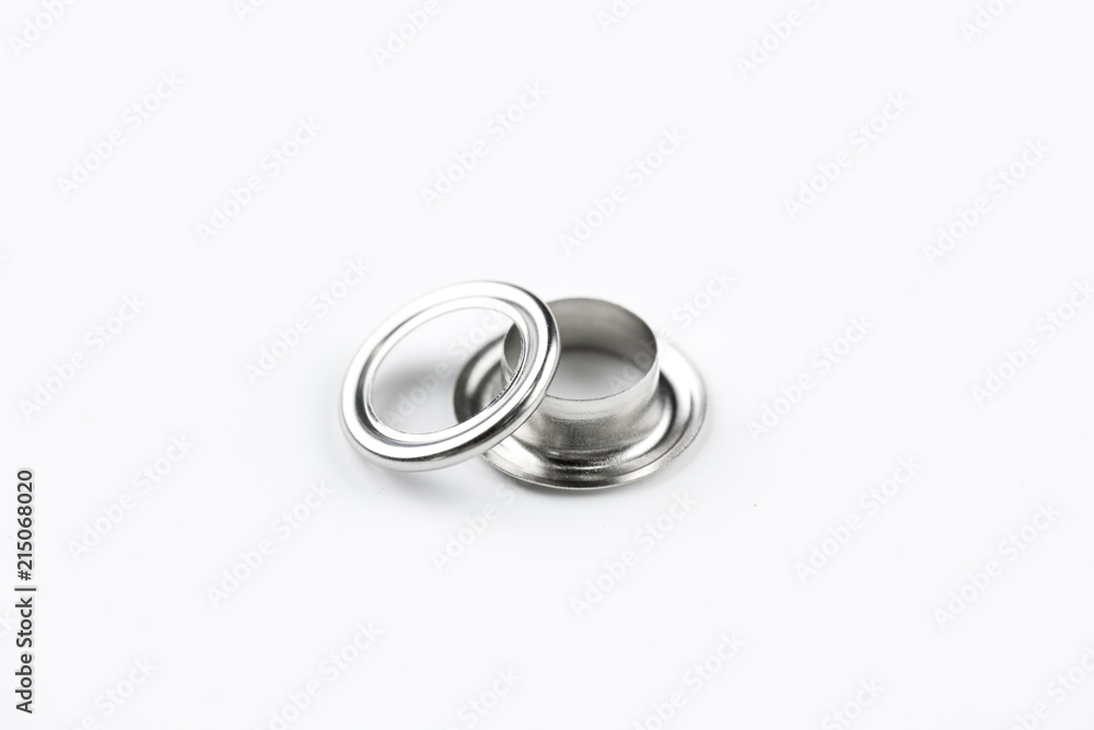 Closeup of shiny eyelet isolated on white background Closeup of shiny eyelet isolated on white background