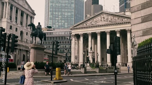 Lady taking a photo of The Royal Exchange in City of London, 2018 photo