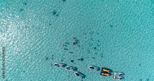 snorkeling in a dream lagoon in French Polynesia, in an aerial view